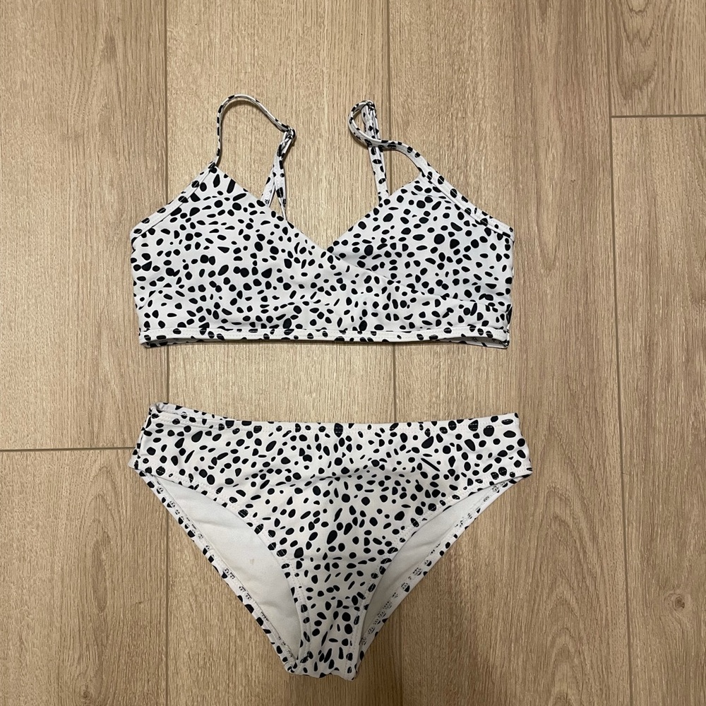 Has padding and is great!! Super comfortable. Is a KIDS bikini